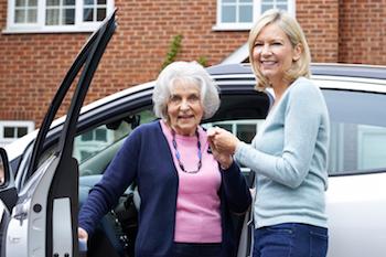 Woman Helping Elderly Woman